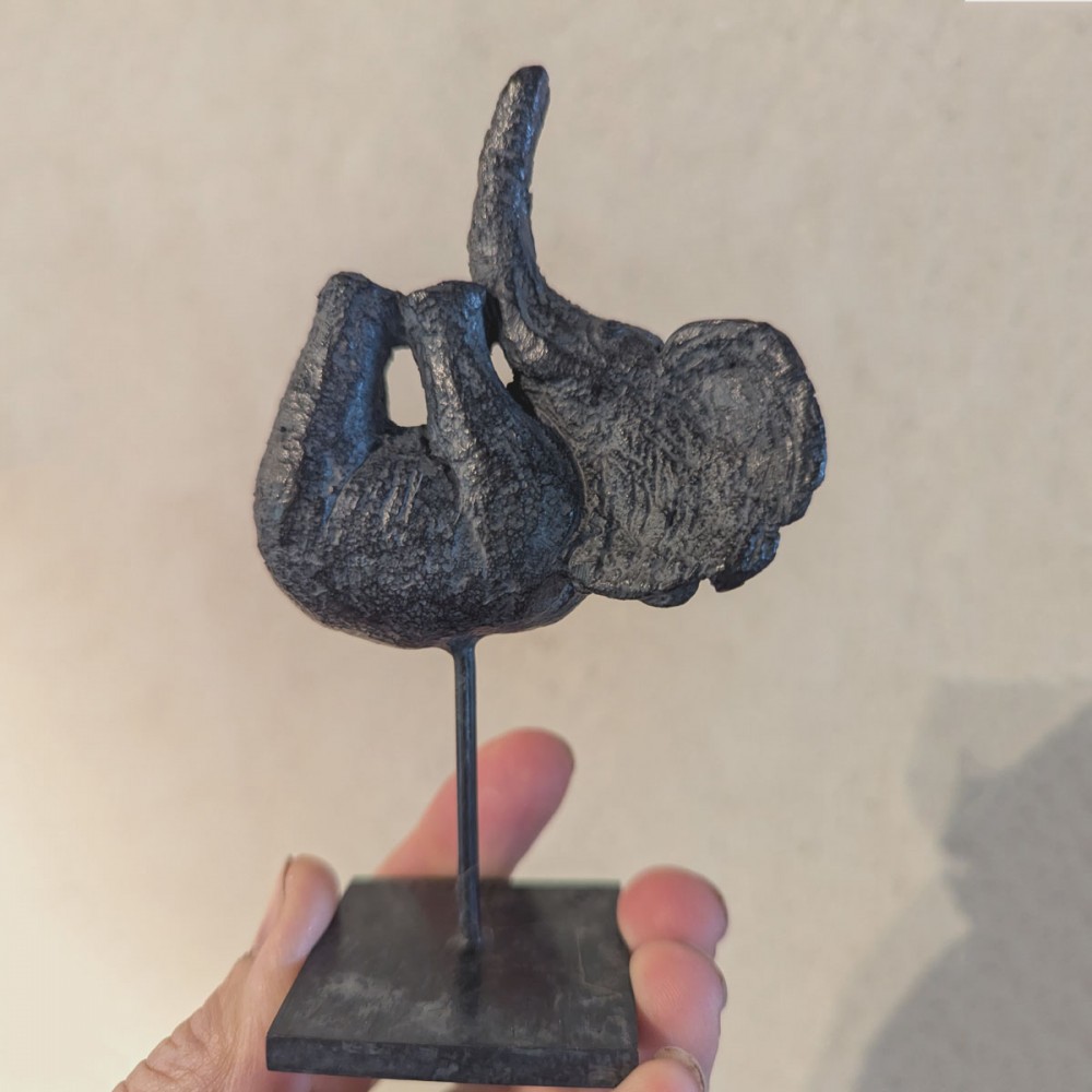 Bronze sculpture Small elephant on it’s back, animal statue in the hand of Sophie